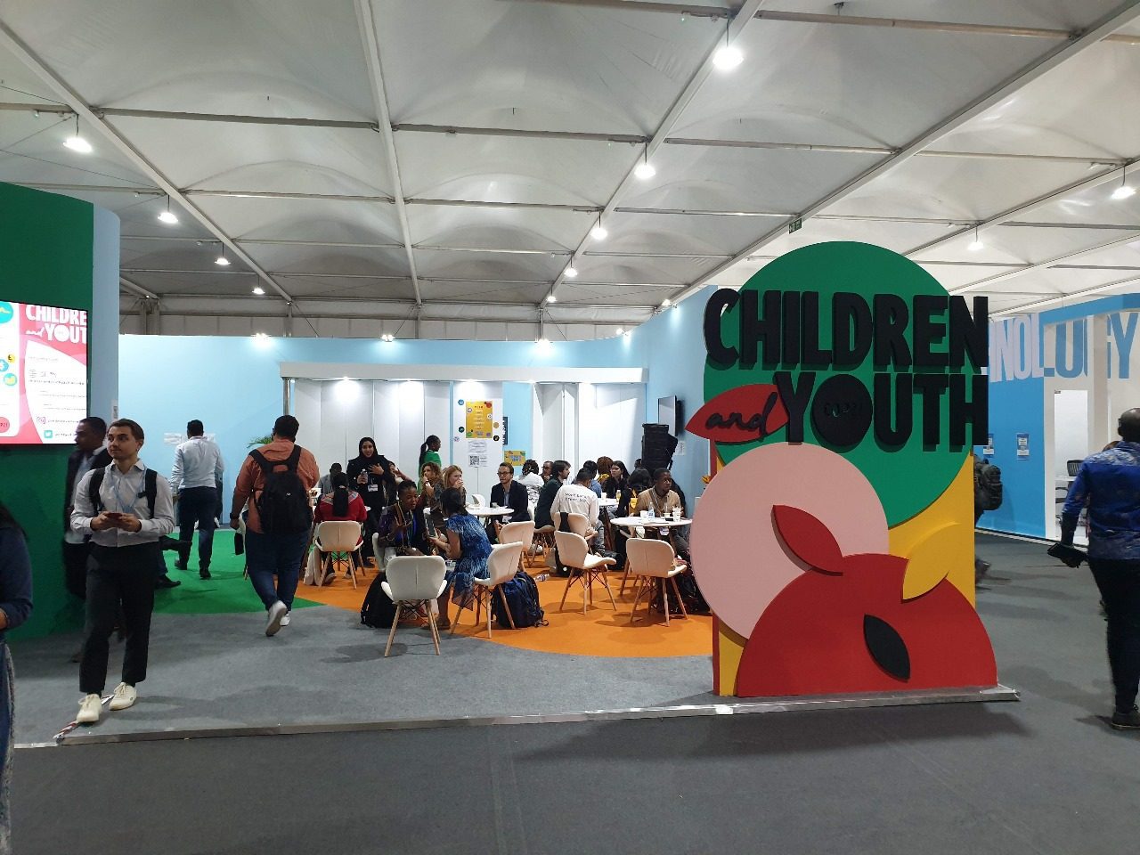 Children and Youth booth at COP27 in Sharm El Sheikh, featuring colorful, engaging displays and interactive elements that highlight the voices and contributions of young people in the fight against climate change.