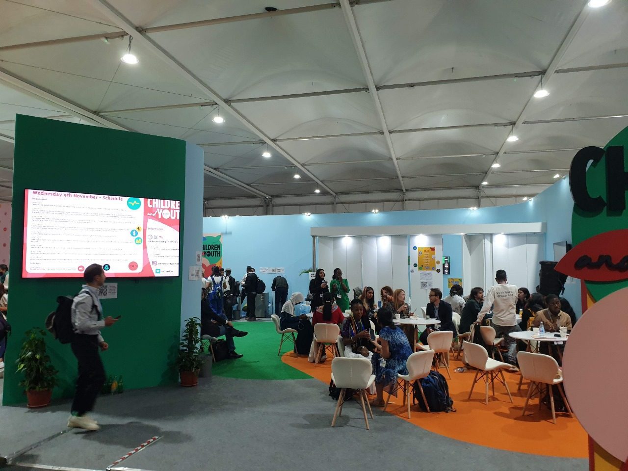 Children and Youth booth at COP27 in Sharm El Sheikh, featuring colorful, engaging displays and interactive elements that highlight the voices and contributions of young people in the fight against climate change.