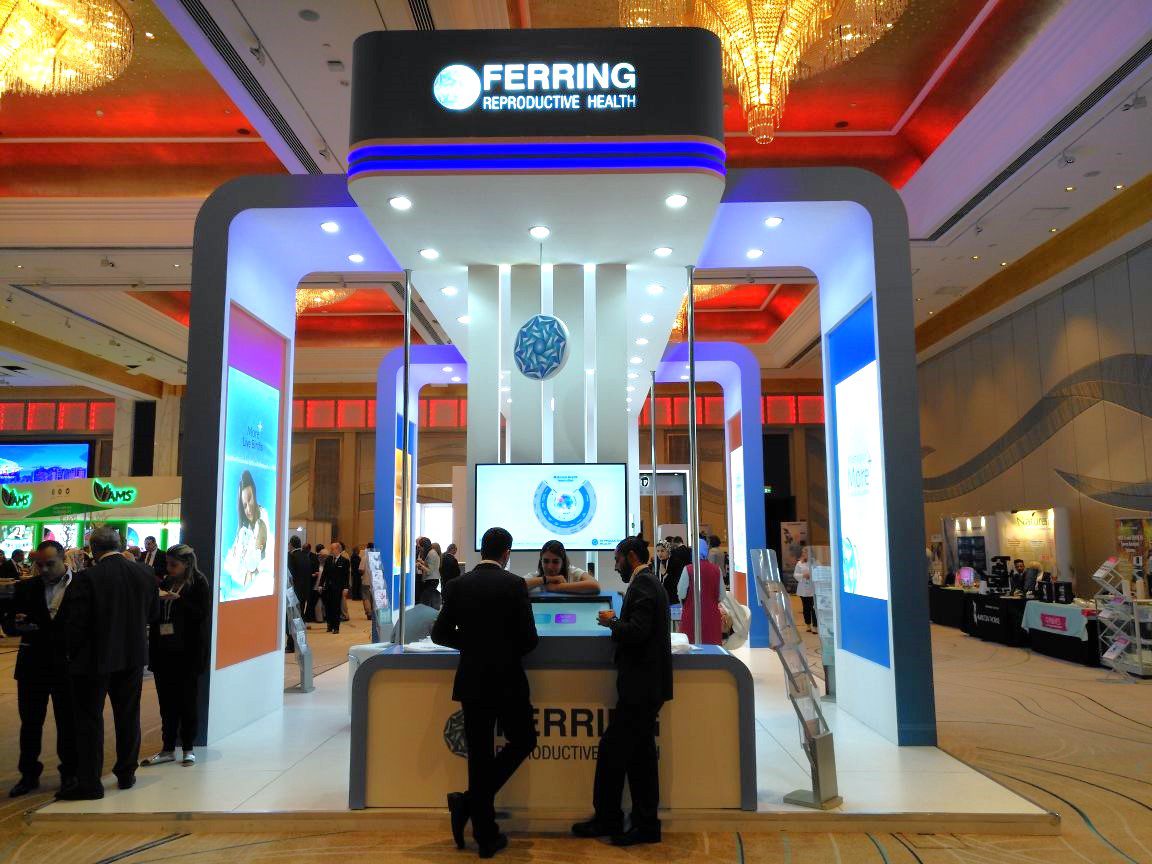 Ferring Pharmaceuticals booth at MEFS 2017 in the UAE, featuring a modern design with interactive displays showcasing innovative healthcare solutions.