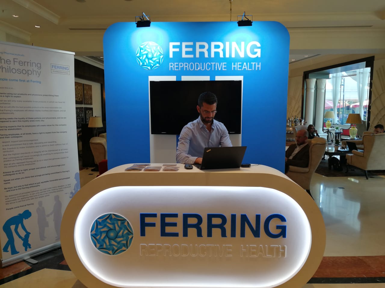 Ferring Pharmaceuticals booth at MEFS 2018 in Beirut, featuring a modern design with sleek lines, interactive displays, and a visually engaging layout showcasing innovative healthcare solutions.
