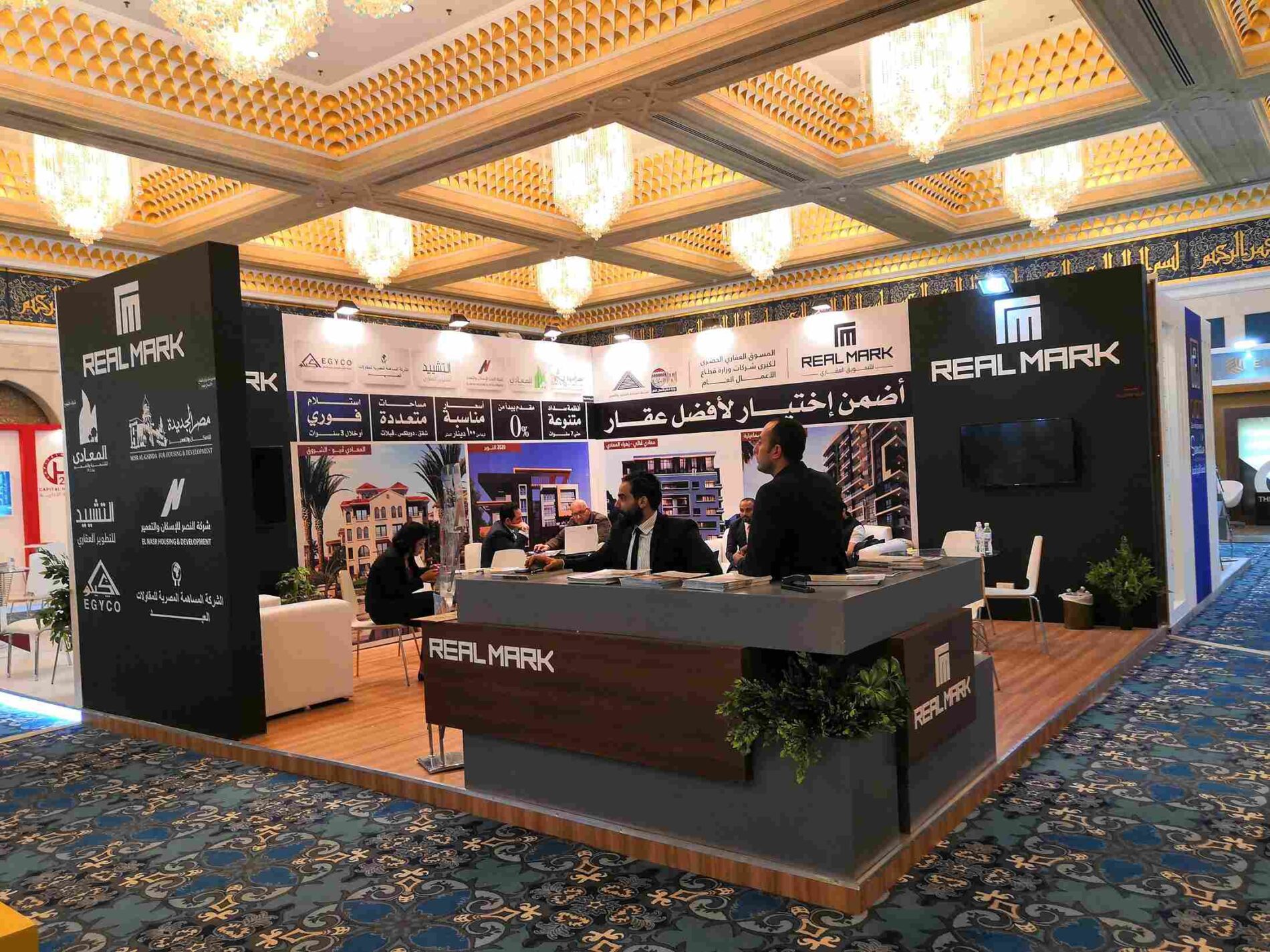 Real Mark booth at Everest Expo 2019 in Kuwait, designed by Masterpiece Marketing Agency, featuring a sleek, modern design with interactive elements and captivating visuals.