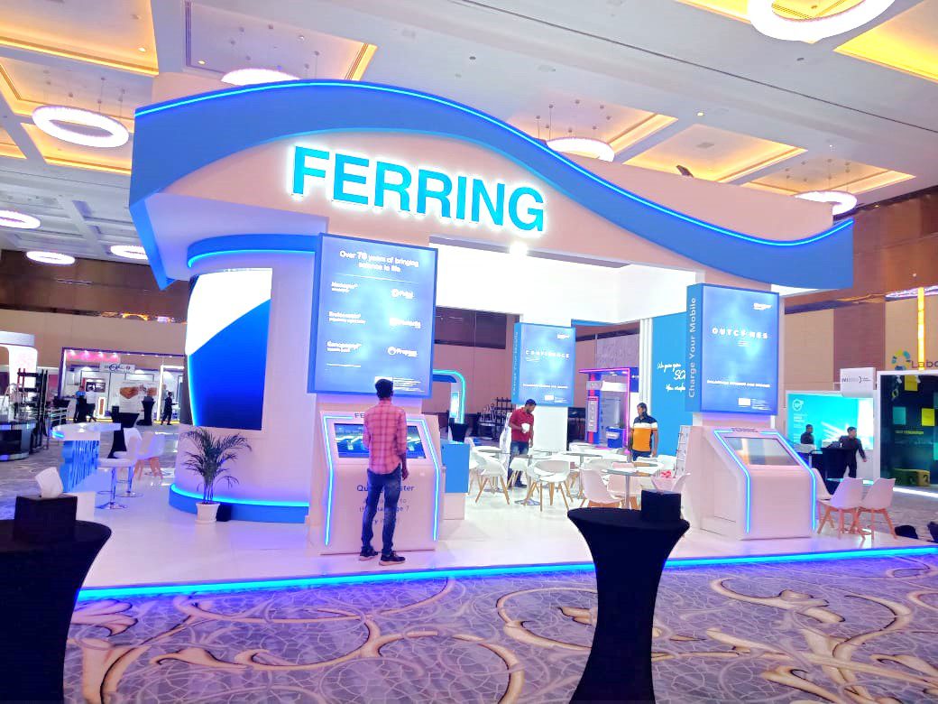 Ferring Pharmaceuticals booth at MEFS 2022 in the UAE, featuring a modern design with interactive displays and advanced technology, showcasing the company's latest healthcare innovations.