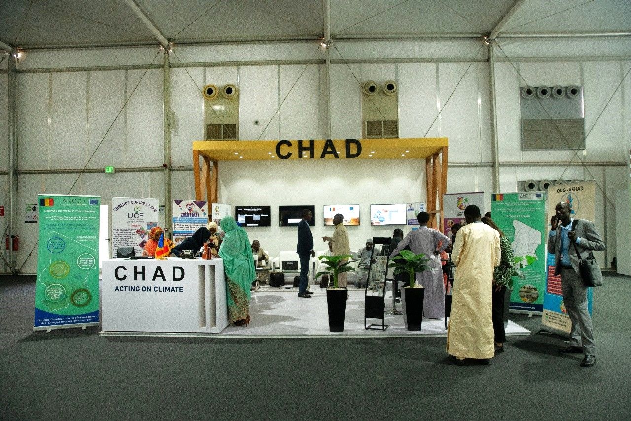 Chad booth at COP27 in Sharm El Sheikh, showcasing a vibrant and culturally rich design with traditional elements, highlighting Chad's commitment to sustainability and climate action initiatives.