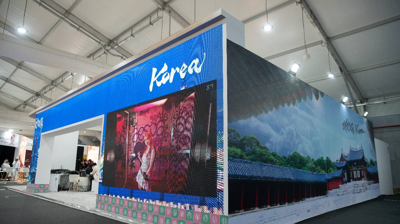 Korea booth at COP27 in Sharm El Sheikh, showcasing a contemporary design with high-tech displays and visual elements that highlight South Korea’s innovations and contributions to sustainable technology and climate action.
