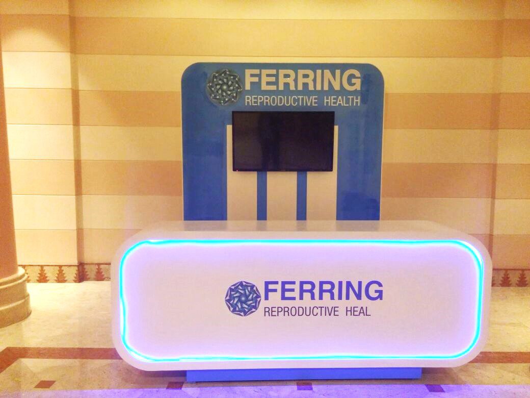 Ferring Pharmaceuticals booth at MEFS 2016 in Sharm el-Sheikh, featuring a sleek, modern design with interactive displays highlighting healthcare innovations.