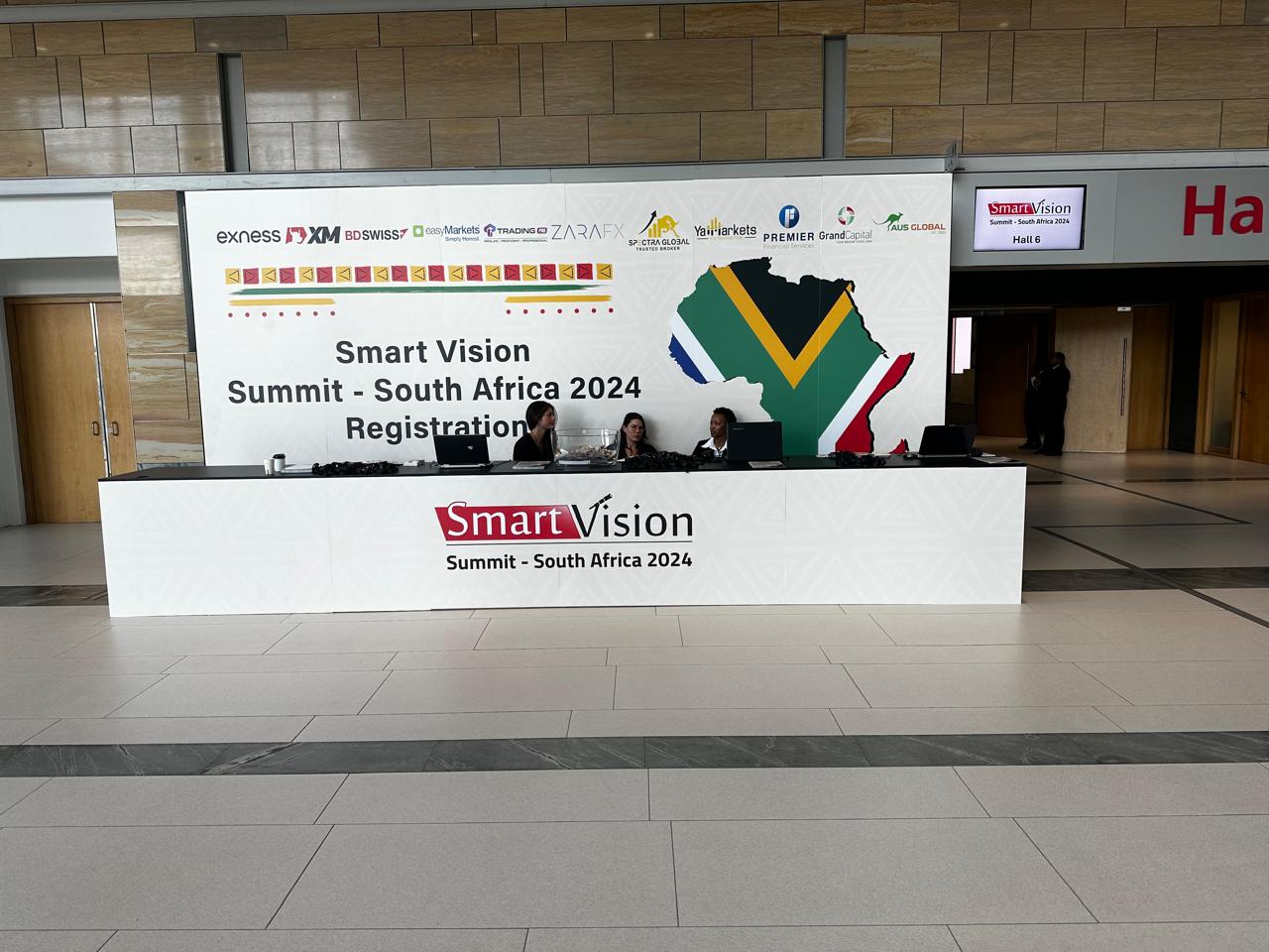 Welcome area at the Smart Vision Summit in South Africa, showcasing a modern entrance with prominent signage and vibrant graphics welcoming attendees to the event.