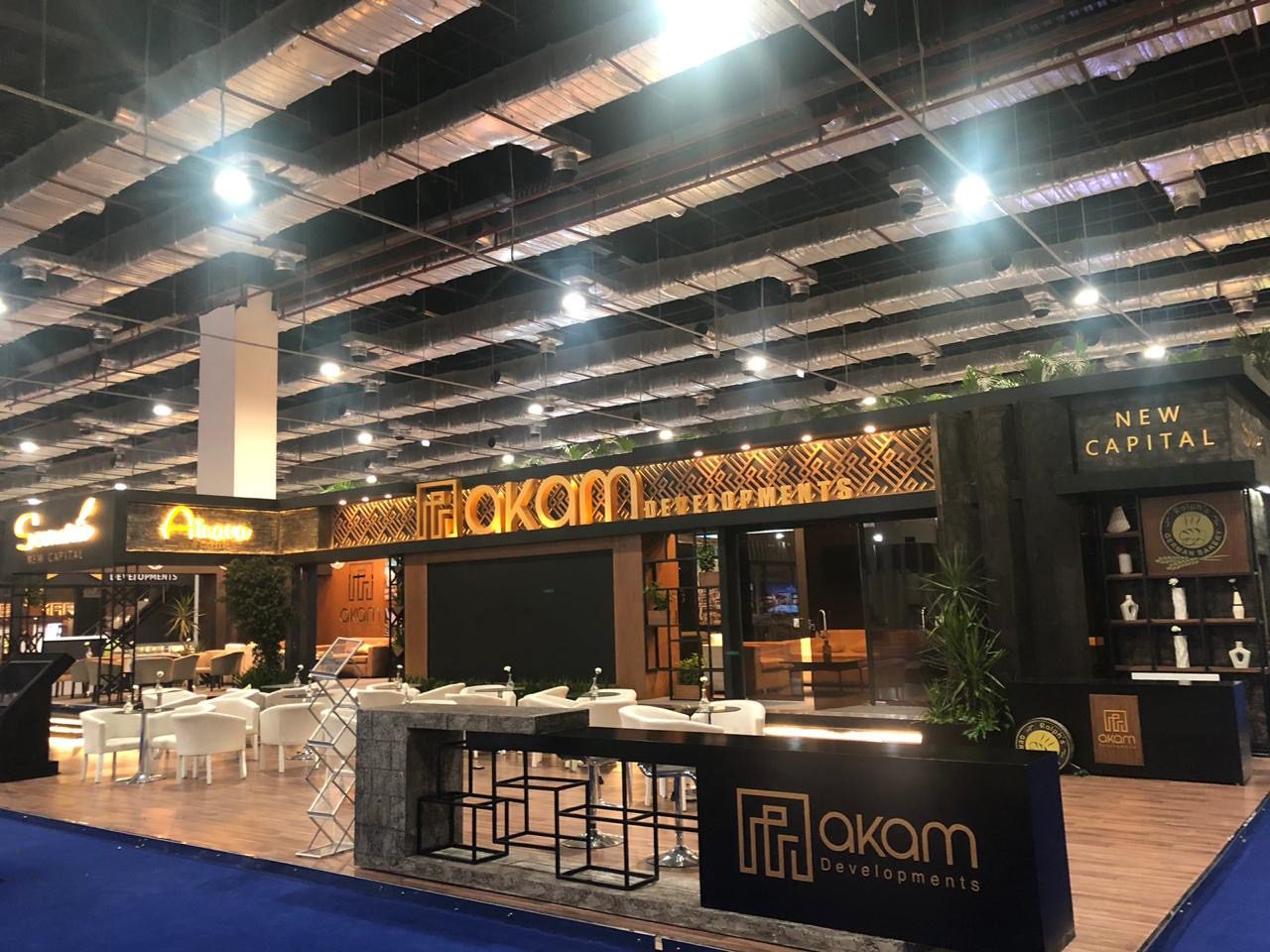 Akam Developments booth at Next Move 2019 showcasing a modern and innovative design with sleek architecture and interactive displays.